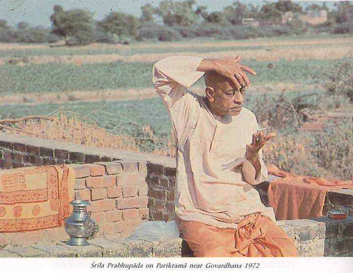 Srila Prabhupada applying Tilak at Govardhana Hill